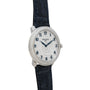 A diamond-encrusted Patek Philippe Calatrava watch features blue numerals and a black leather strap.