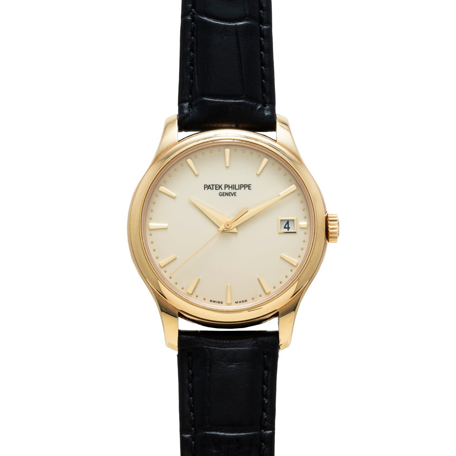 The Patek Philippe Calatrava is a gold wristwatch with a black leather strap and a white dial featuring a date display.