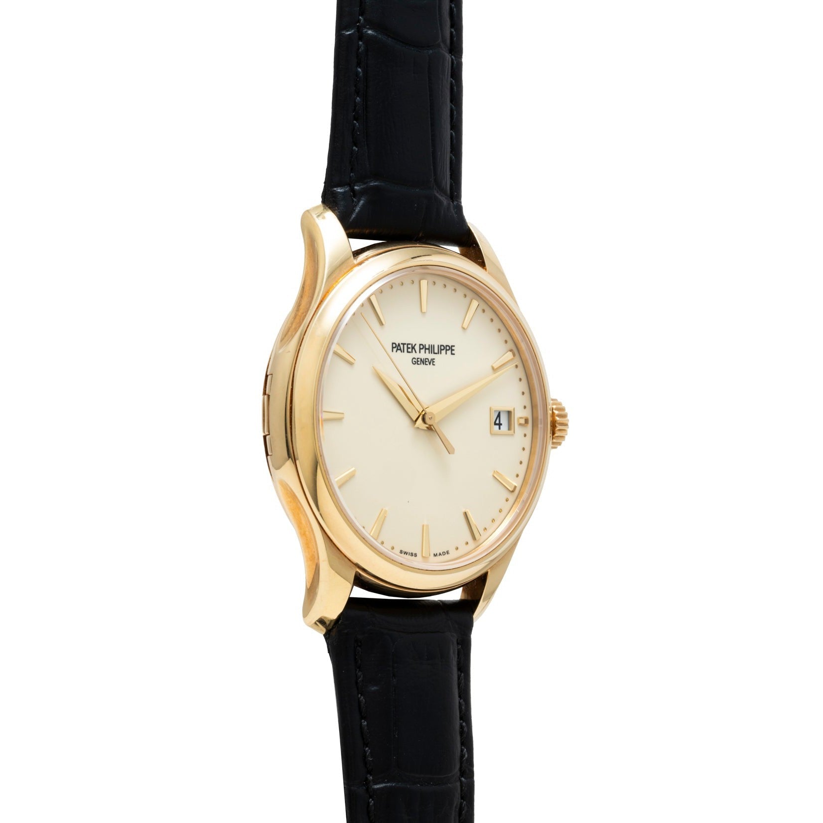 Patek Philippe Calatrava gold wristwatch with a cream dial, date window, and black leather strap, shown in a side view.