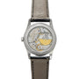Back view of the Patek Philippe Calatrava luxury watch, showcasing its visible mechanical movement and black leather strap.