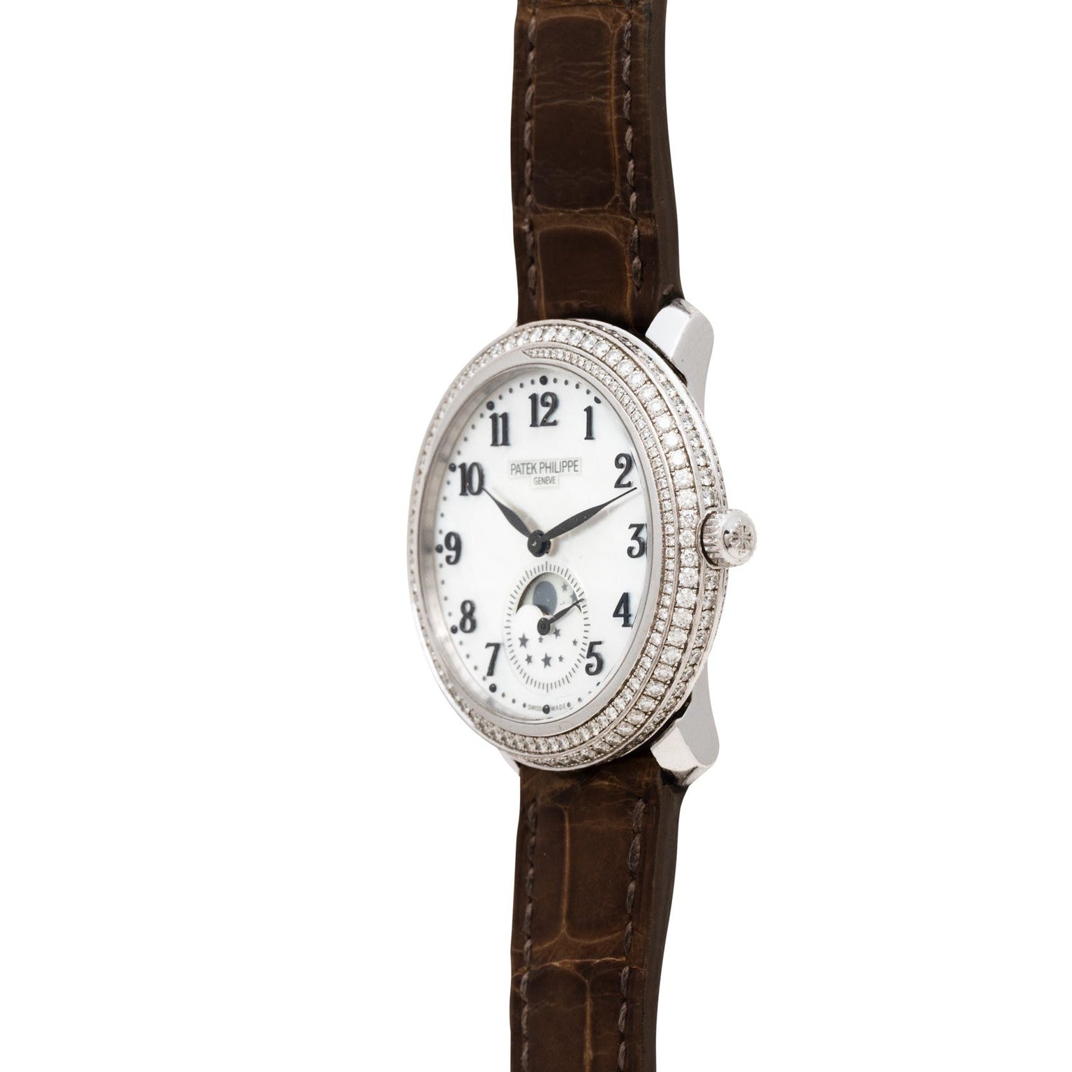 The Patek Philippe Ladies Complication wristwatch features a diamond bezel, white dial, and brown leather strap, shown angled to the right.