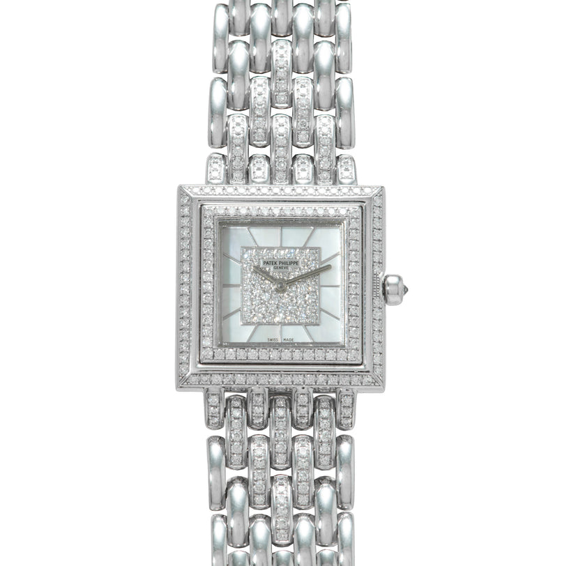 The Patek Philippe Gondolo is a luxury silver wristwatch featuring a square diamond-encrusted face and a linked bracelet band.