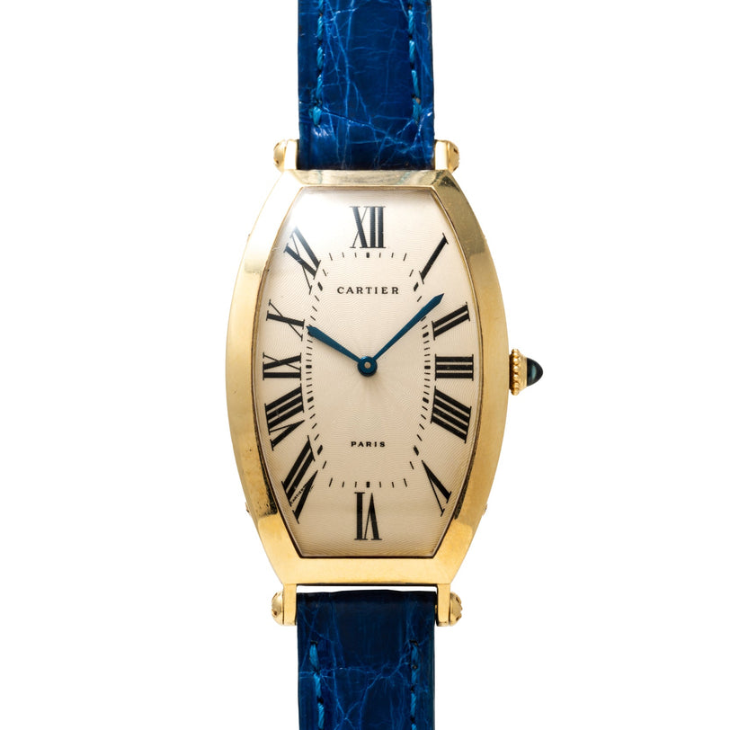 Cartier Tonneau XL watch with Roman numerals and a blue leather strap, displayed on a white background.