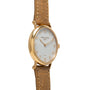 Patek Philippe Calatrava gold wristwatch with a brown leather strap and white dial, shown at an angle.