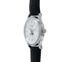 Side view of a silver Patek Philippe Annual Calendar Moonphase wristwatch featuring a white dial and black leather strap.