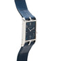 The Cartier Privé Collection Tank Asymétrique New York Edition features a blue face, a blue leather strap, and a rectangular silver case.