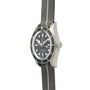 The TUDOR Black Bay 58 Silver is a dive watch with a black bezel and dial, paired with a gray fabric strap featuring a white center stripe.