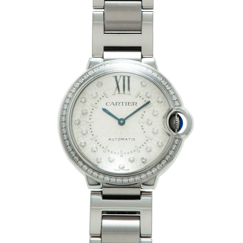 Silver stainless steel Cartier Ballon Bleu watch with diamond bezel, silver dial, Roman numerals, and matching bracelet.