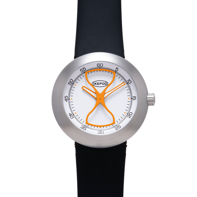 Ikepod Megapod watch with brushed steel case, white dial, orange hourglass-shaped hands, and black rubber strap.