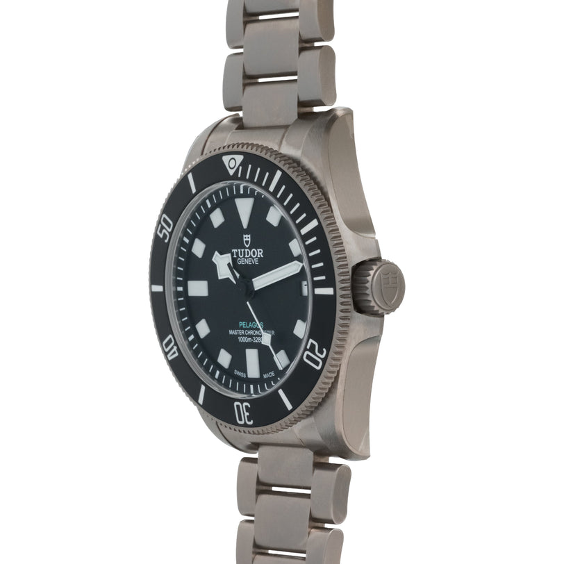 Stainless steel dive watch with black dial, white hour markers, rotating bezel, and matching bracelet.