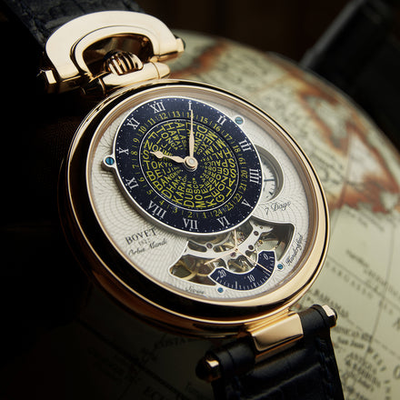 A luxury Bovet wristwatch with world time display, shown resting on a globe.