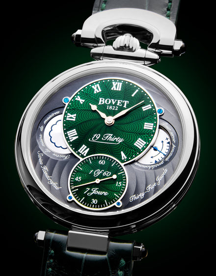 Luxury Bovet watch with green and silver dials, Roman numerals, and a leather strap, shown close up.