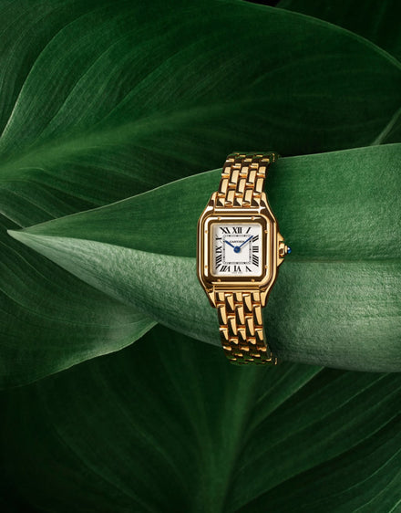 Panthère de Cartier flat lay on a leaf