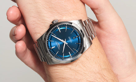 Longines Conquest watch with a blue dial and a steel bracelet