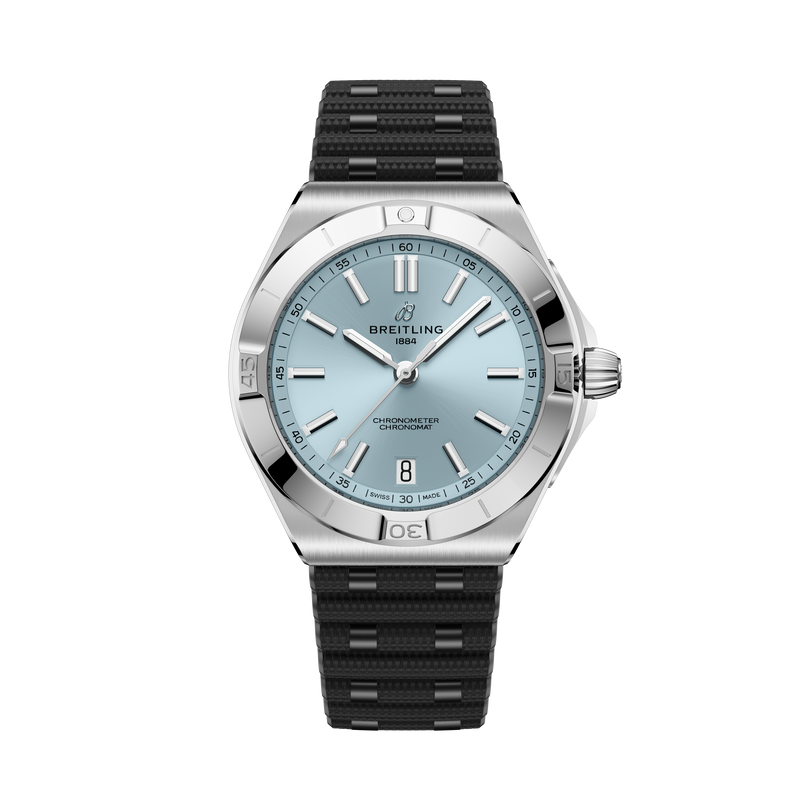 Stainless steel watch with light blue dial, applied hour markers, date window, and black rubber strap with silver accents.