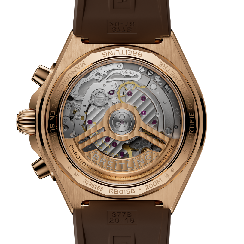 Rose gold watch with brown rubber strap and exposed mechanical movement visible through transparent case back.