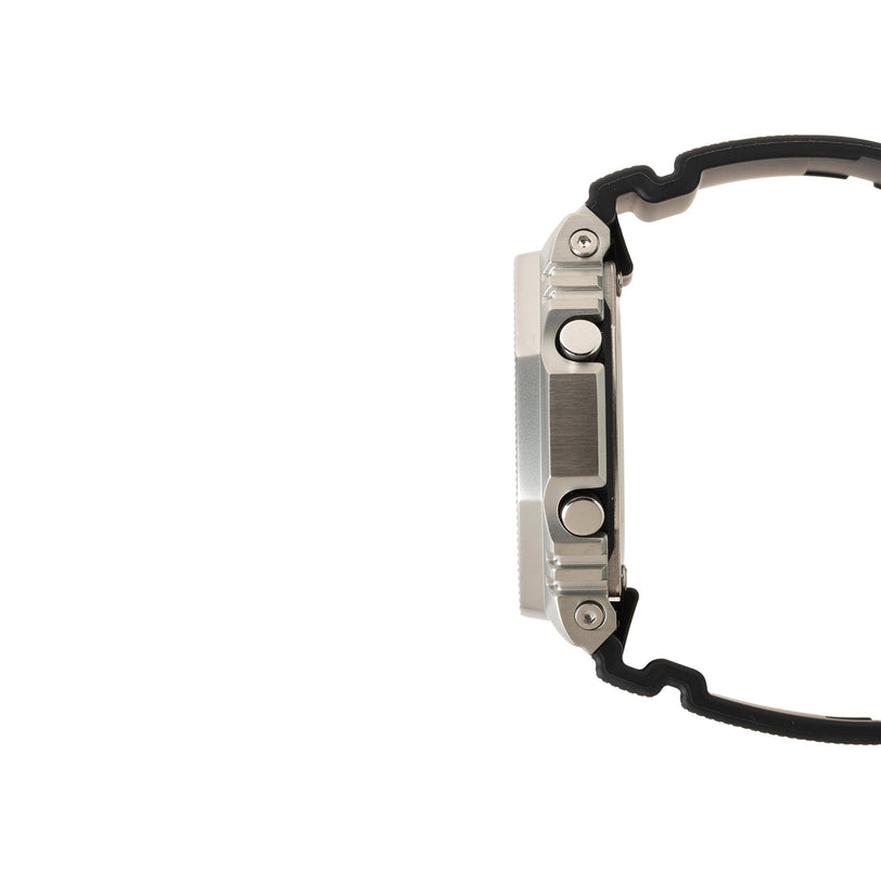 Silver stainless steel digital watch with black resin band shown from the side profile.