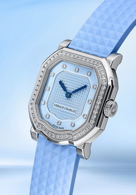 Gerald Charles watch with light blue face and strap on a matching background