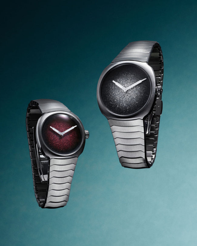 Two watches with unique designs on a gradient blue background