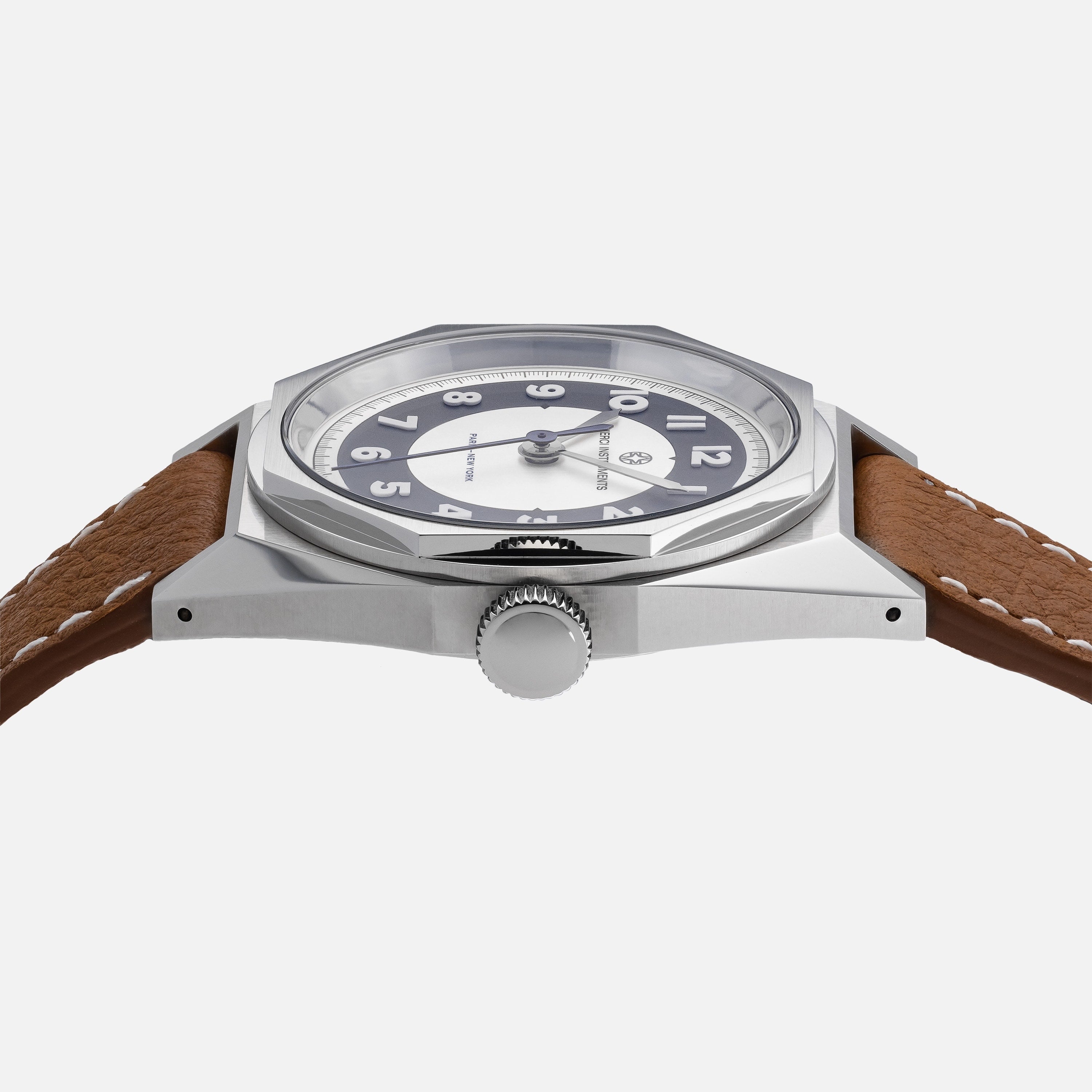 Side view of the Merci INSTRUMENTS Beaumarchais H02 Limited Edition For Hodinkee by Merci, featuring a silver case, brown leather strap, and black-and-white dial.