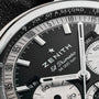 Close-up of the Zenith Chronomaster Original Triple Calendar Limited Edition for Hodinkee watch face, showing detailed markings, chronograph subdials, and 36,000 VpH on a black and silver dial—a showcase of Zeniths modern chronograph design.