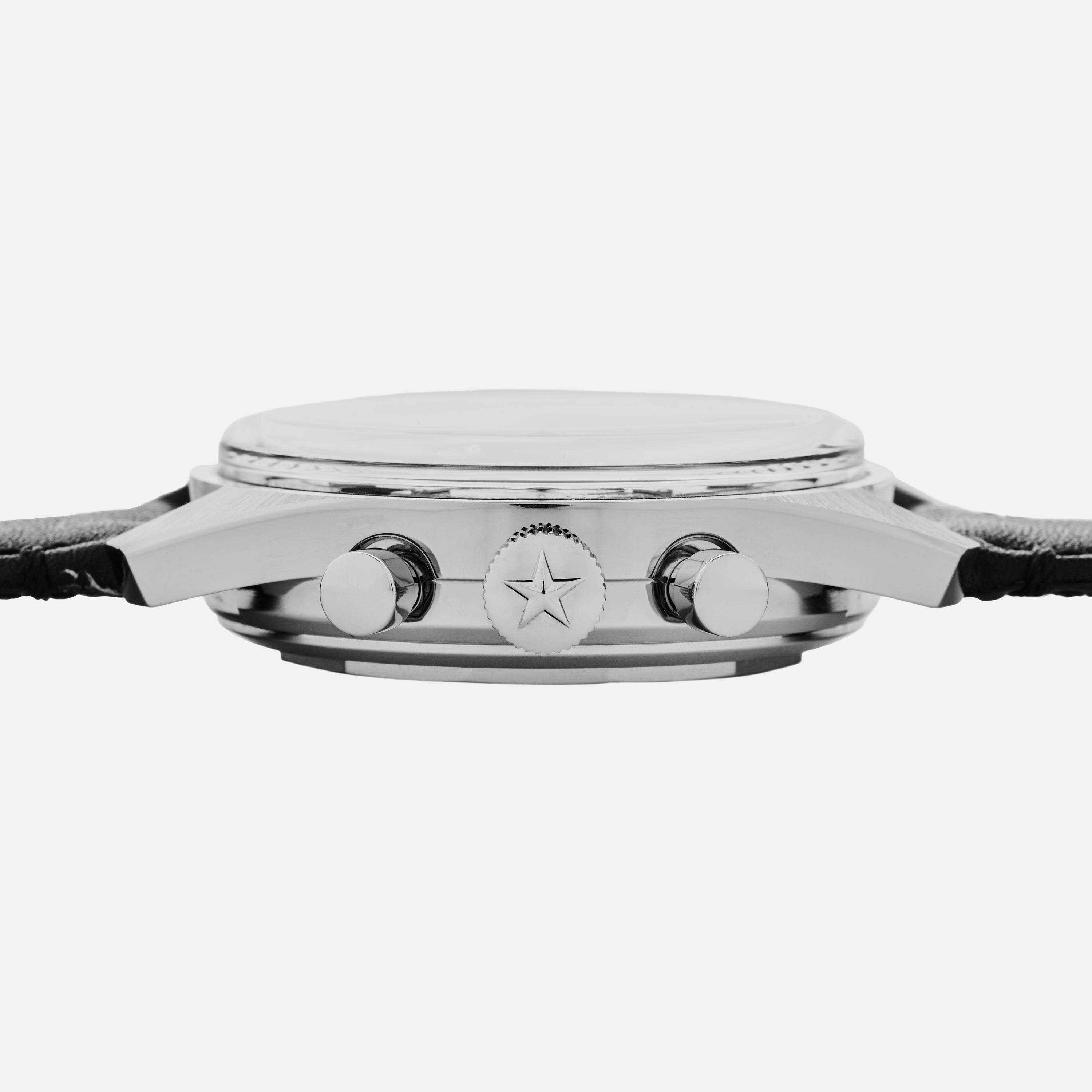 Side view of the Zenith Chronomaster Original Triple Calendar Limited Edition For Hodinkee: silver case with star-emblazoned crown, two pushers, and black leather strap—highlighting modern chronograph design.