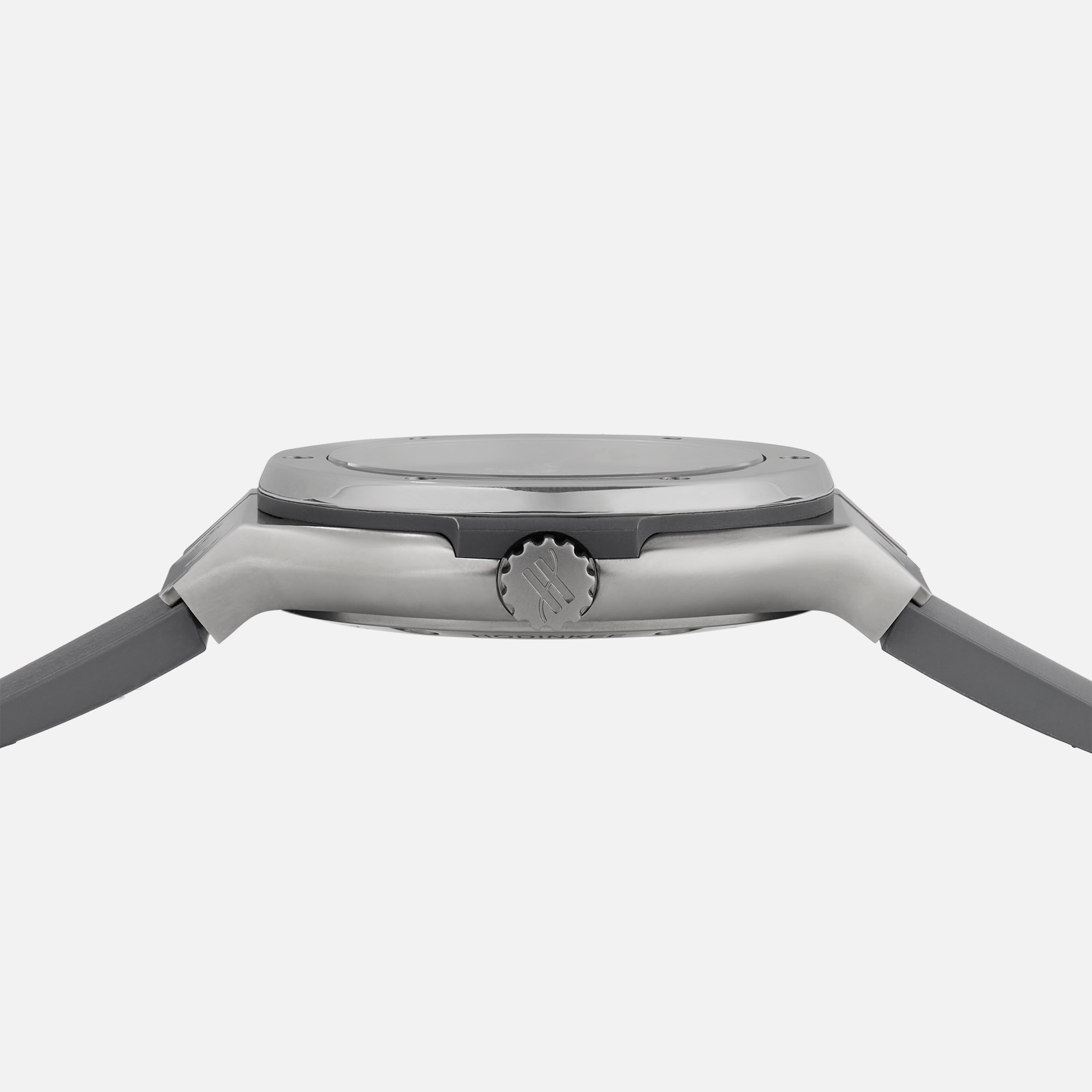 Side view of the Hublot Classic Fusion Titanium Limited Edition for Hodinkee wristwatch, displaying its bezel, crown, and case with straps attached, set against a plain white background.