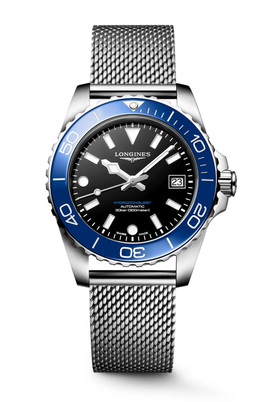 Watch with blue bezel and silver mesh band on a white background