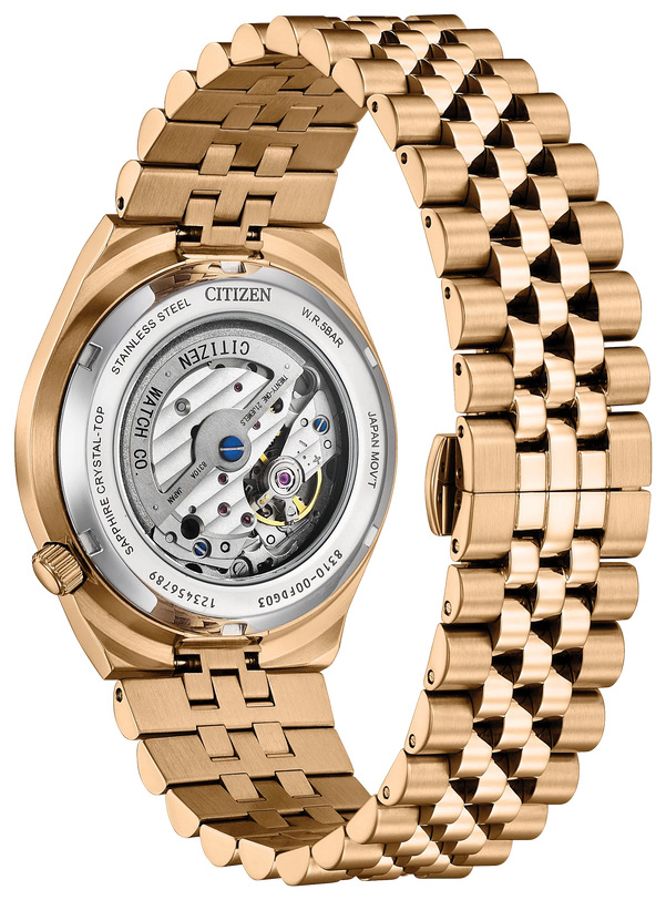 Rose gold-tone stainless steel watch with white dial, blue accents, and visible mechanical movement through exhibition caseba
