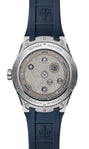 Back view of the Ulysse Nardin Blast Free Wheel Maillechort watch with a blue strap, featuring exposed movement and engraved details.