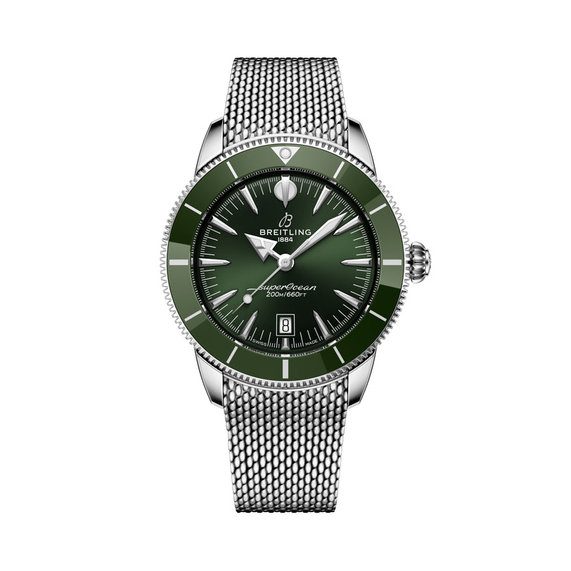 The Breitling Superocean Heritage B31 Automatic 44 features a green dial, silver mesh band, silver hour markers, and a date window at 6 o’clock.