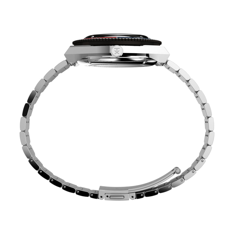 Side view of the Timex M79 Automatic x Peanuts, a silver metal wristwatch with round case and stainless-steel bracelet, shown against a white background. The open clasp reveals crown and bezel details.