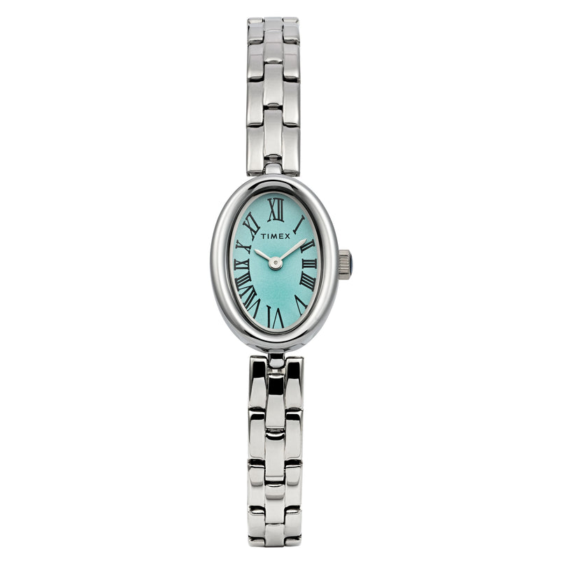 The Timex Cavatina features a silver-tone case and bracelet with an aquamarine dial, black Roman numerals, and an oval face. The Timex logo is visible on the dial.