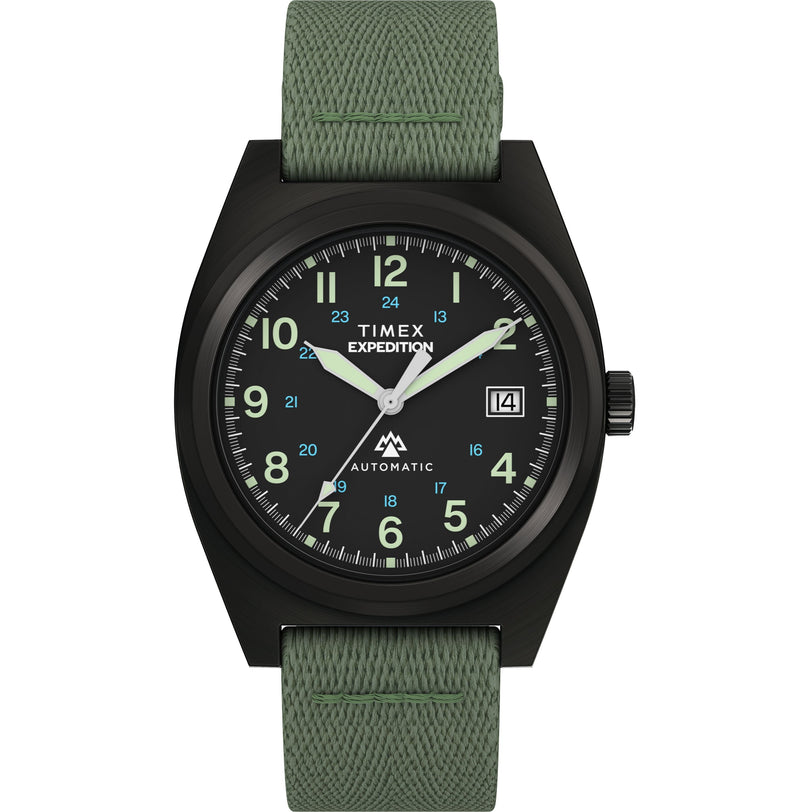 The Timex Expedition® Capstone Automatic watch has a 39mm stainless steel case, green fabric strap, black dial with luminous hands and numerals, date at 3 o’clock, and “AUTOMATIC” above 6 o’clock.
