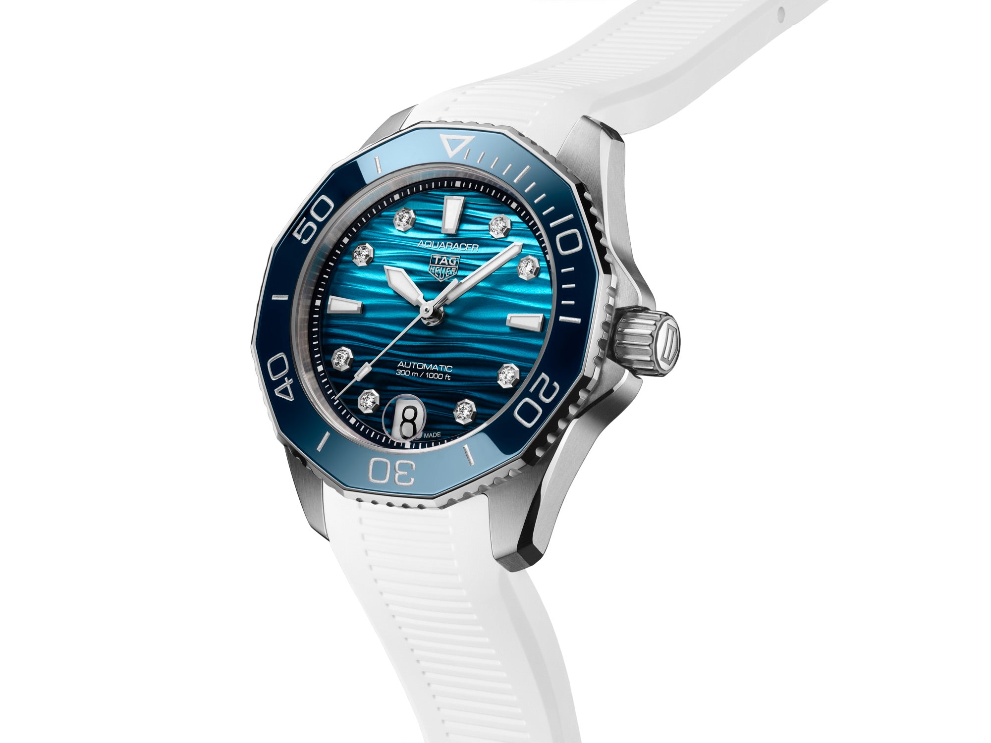 The TAG Heuer Aquaracer Professional 300 Date, featuring a blue face, diamond markers, and a white strap, is pictured at an angle on a white background.