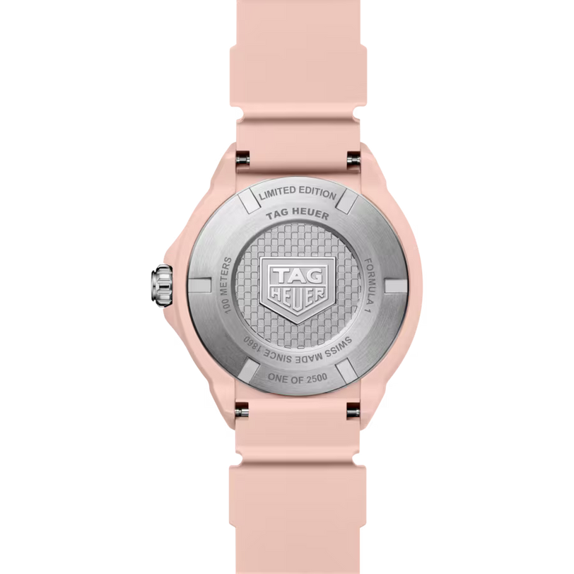 Tag Heuer watch with pink strap and silver case on a white background
