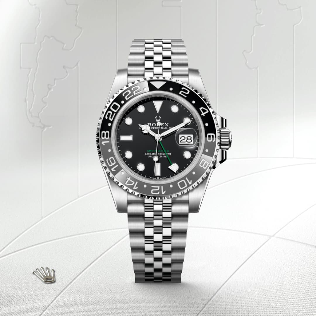 A silver Rolex watch with a black dial and date display, set against a map-themed background.