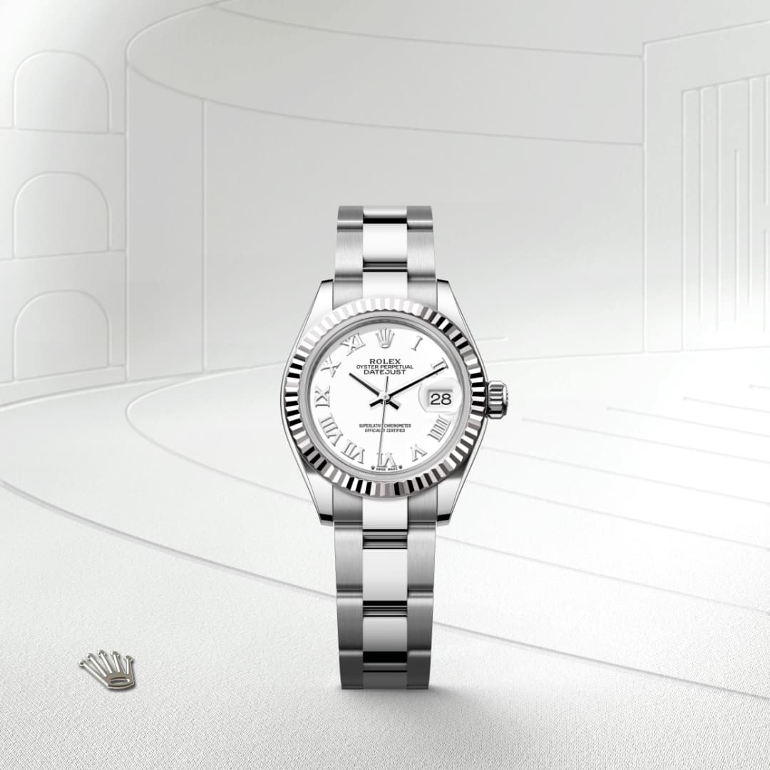 A silver Rolex wristwatch with a white face and Roman numerals displayed against a minimal, light background.