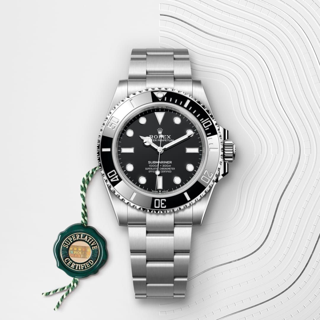 A silver Rolex Submariner watch with a black dial and bezel, next to a green Superlative Certified tag.