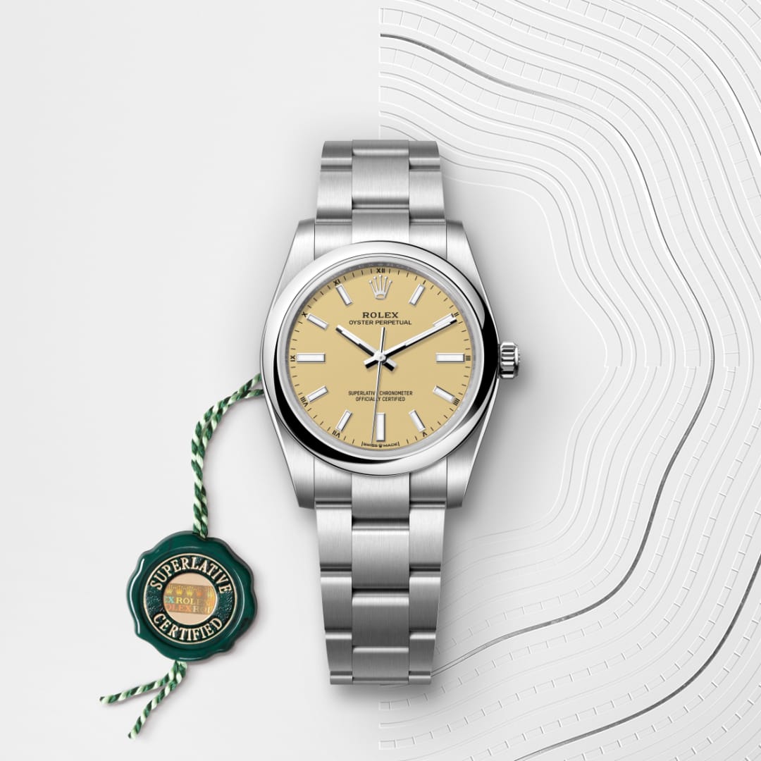 A silver Rolex watch with a beige face and green Superlative Certified tag on a textured white background.