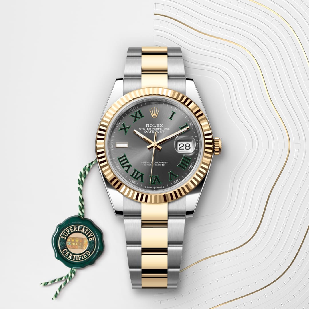 A two-tone Rolex watch with a grey dial, green Roman numerals, and a Superlative Certified tag.