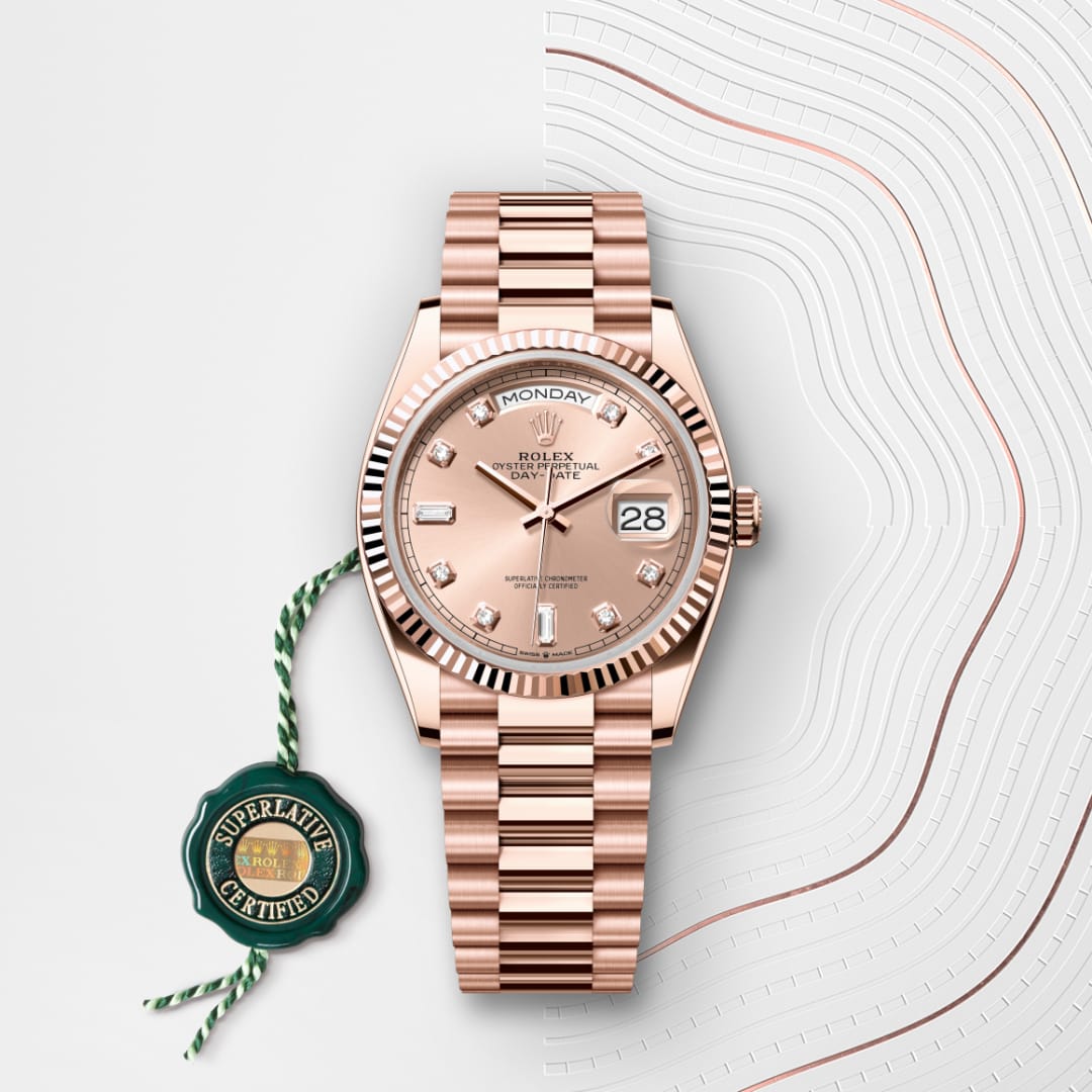 A rose gold Rolex watch with a diamond dial and day-date display, placed next to a green Superlative Certified tag.