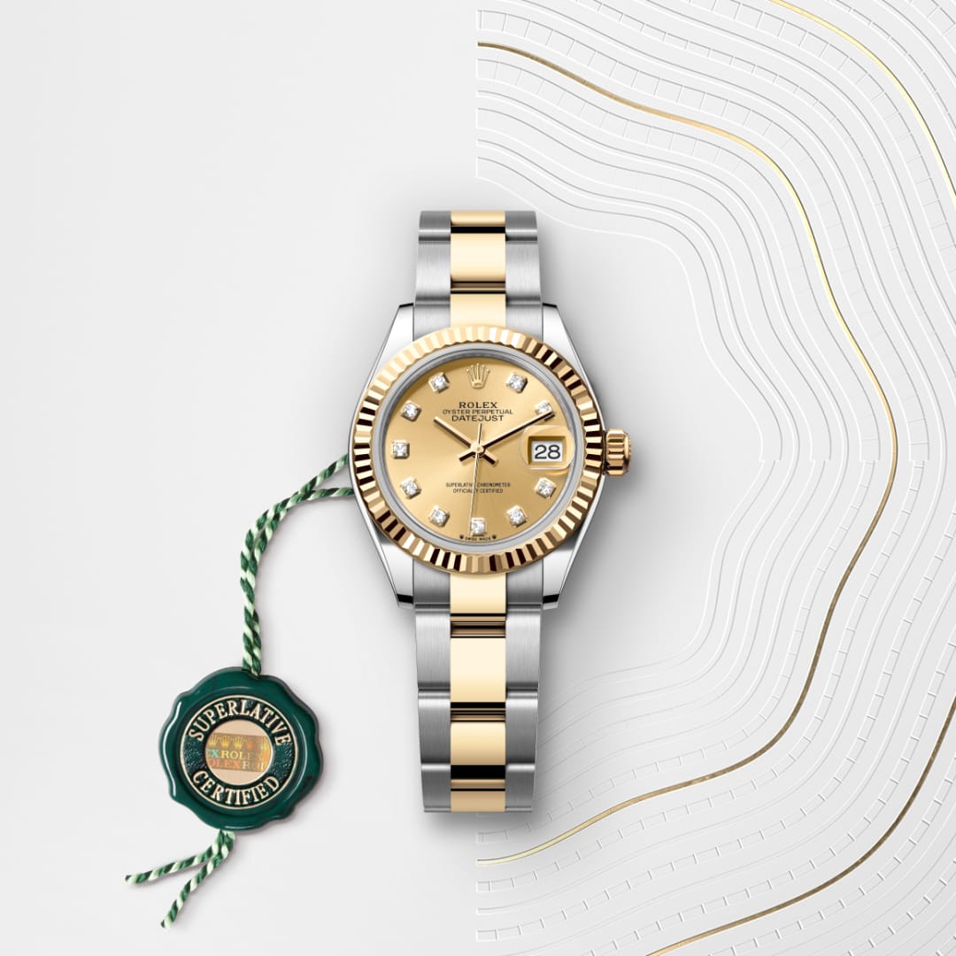 A two-tone gold and silver Rolex watch with diamond markers and a green Superlative Certified tag.