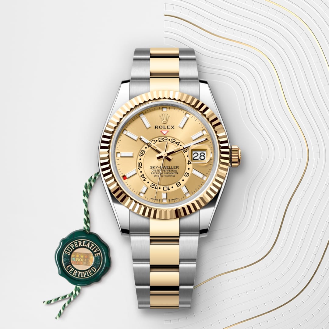 A gold and silver Rolex Sky-Dweller watch with date display and a green Superlative Certified tag.