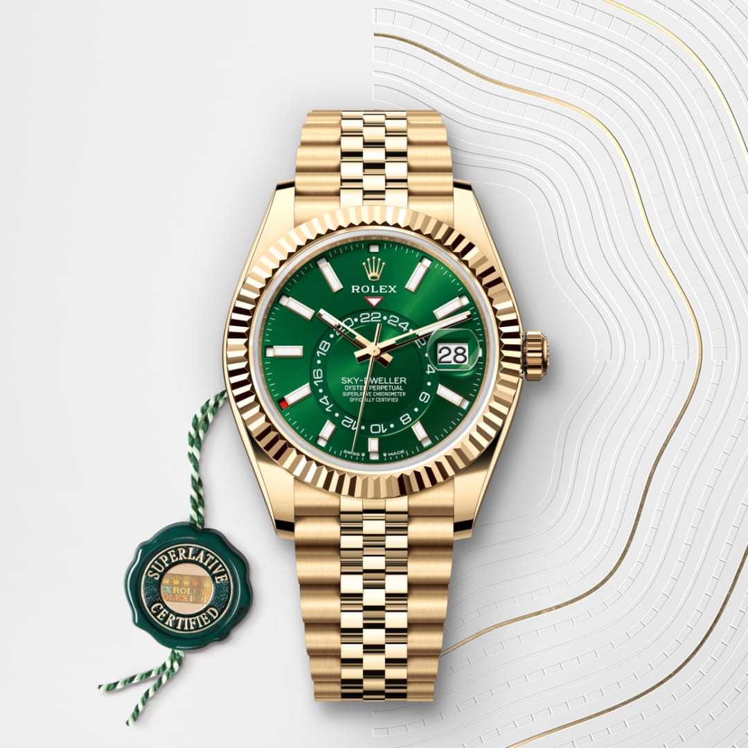 A gold Rolex Sky-Dweller watch with a green dial, date display, and Superlative Certified tag.