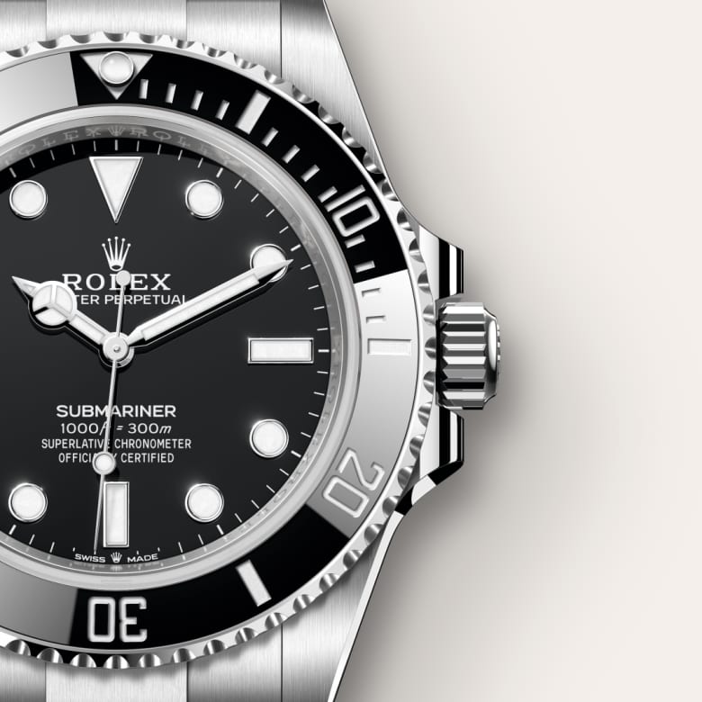 Close-up of a Rolex Submariner watch showing a black dial, bezel, and stainless steel case and bracelet.