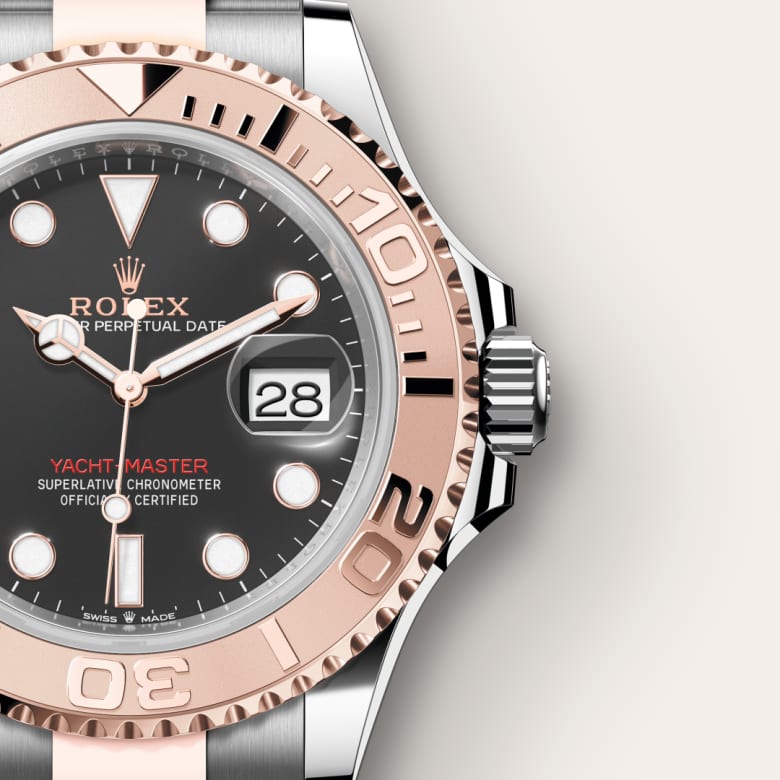 Close-up of a Rolex Yacht-Master watch showing the time, date, and rose gold bezel on a stainless steel case.