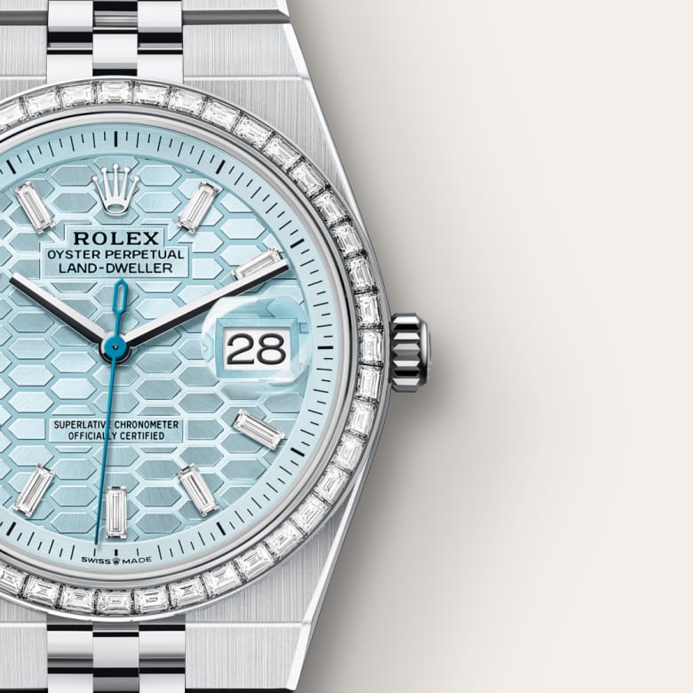 Close-up of a Rolex Land-Dweller watch with an ice blue honeycomb dial and diamond bezel.