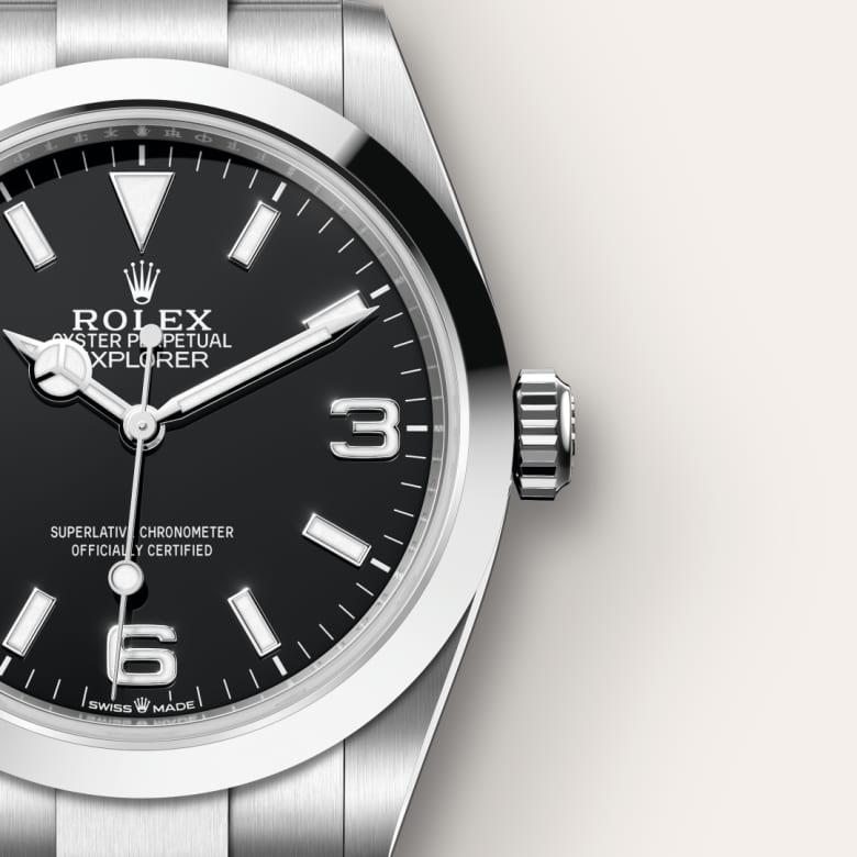 Close-up of a Rolex Oyster Perpetual Explorer watch with a black dial and silver stainless steel case.