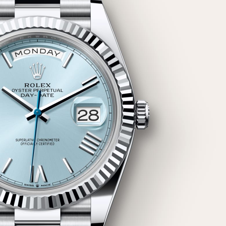 Close-up of a Rolex Oyster Perpetual Day-Date watch with a light blue dial showing Monday and the 28th.